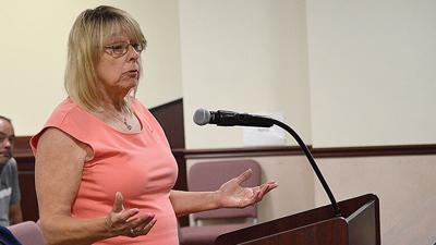 Lynette Rasch speaks against plans to build a 99-home subdivision before the Jefferson County Planning and Zoning Commission on June 8.
