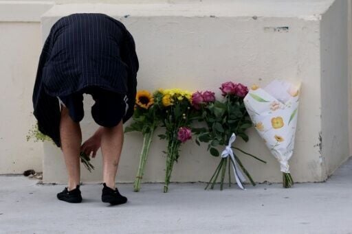 People lay flowers for the dead in Australia's Bondi Beach attack