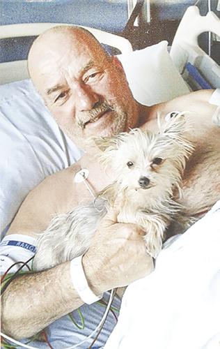 Tim Secrease of Crystal City says his dog, Morkie, looks after him