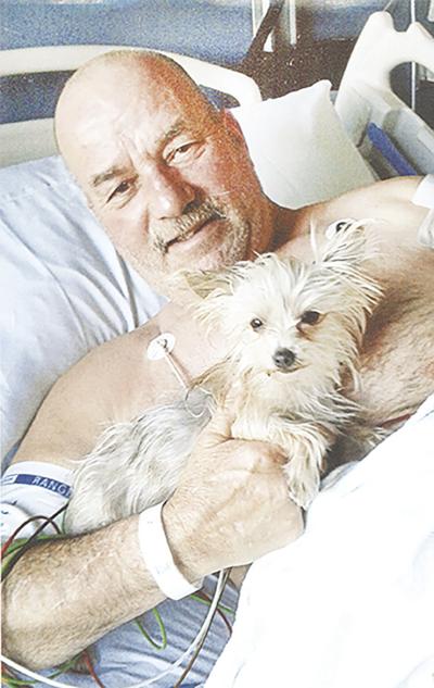 Tim Secrease of Crystal City says his dog, Morkie, looks after him