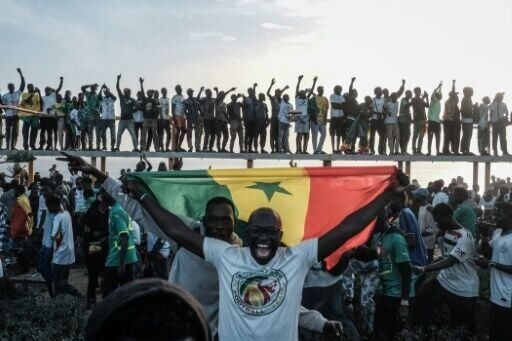 Fan in Dakar celebrated Senegal's win over Morocco 1-0 in a chaotic final in Rabat