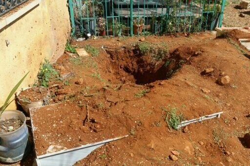 In the town's cemetery, an AFP journalist saw a hole that looked like a dug-up grave