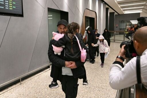 A group of Australian women linked to Islamic State fighters returned home from a camp in Syria, some landing at Melbourne airport
