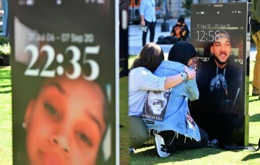 Bereaved parents and family members view images of deceased children displayed at the 'Lost Screen Memorial' in Los Angeles, an art installation featuring 50 children who lost their lives due to online harm