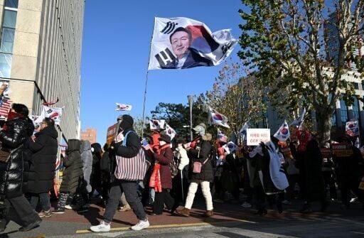 Supporters of South Korea's ousted president Yoon Suk Yeol defend his decision to declare martial law a year ago