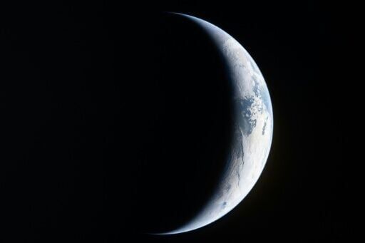 An Artemis II crewmember took a picture showing a sliver of Earth from the window of the Orion spacecraft