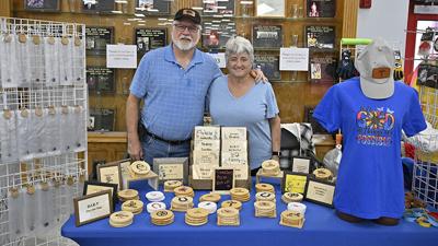 Andy and Chrissy Ellegood of  Imperial, owners of “Crafty Eye Creations,” show off their wares at the Fall Craft Fair last year.