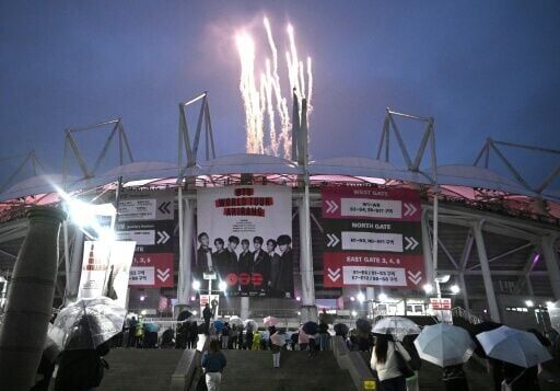 Fireworks explode at a stadium where K-pop boy band BTS is performing in Goyang on April 9, 2026.