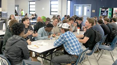 Northwest High School administrators said the cafeteria was louder this school year during lunch because students were not allowed to use their cell phones following a state-imposed cell phone ban during the school day.