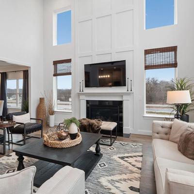 Shown is a picture Dawn Thurman describes as “a two-story great room featuring a fireplace with box molding surround” at a Braxton display home in Lake St. Louis.