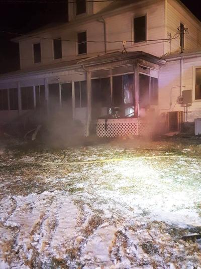 A man suffered smoke inhalation after a fire started in the porch at his De Soto-area home.