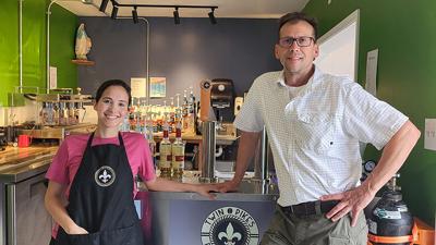 Twin Pikes Roastery owner Matt Macheca with his daughter, Isabelle, who also manages the coffee shop. Plans are in the works to expand the drive-thru coffee shop.