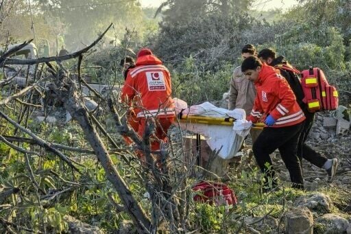 First aid responders evacuate a body from the site of an Israeli airstrike that targeted the southern Lebanese city of Tyre