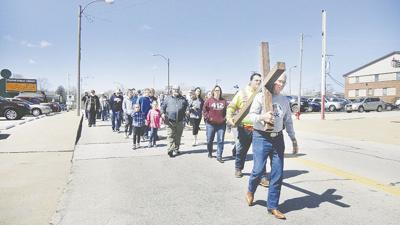 The 2018 Twin City Area Ministerial Alliance cross processional along Main Street and Bailey Road.