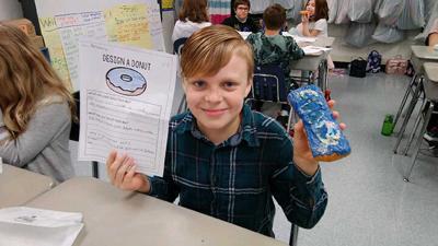 Brad Aisentat’s design features blue colors and icing swirls.