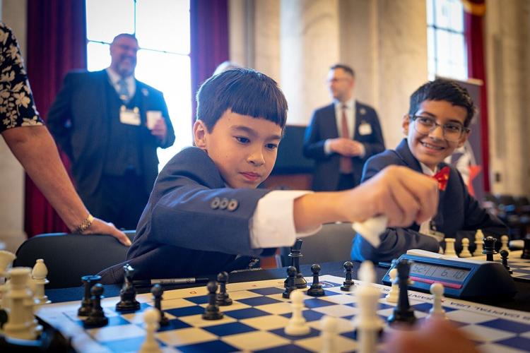 Teddy Mazur, 8, participates in the chess tournament