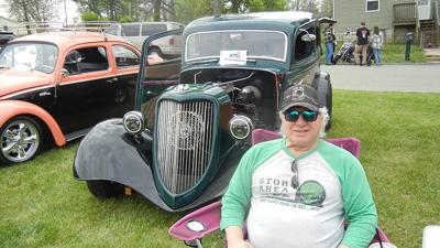 Dan Picarella of Herculaneum sits next to his 1933 Ford Victoria at the April 11 show.