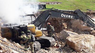 This excavating equipment caught fire while working at construction site where a home is being built on Bogey Boulevard in Arnold.