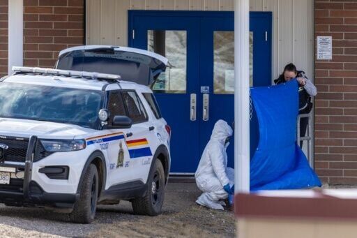 Investigators work the crimes scene at Tumbler Ridge Secondary School after a mass shooting rocked the rural community of Tumbler Ridge, Canada