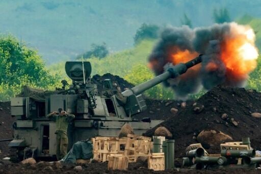 An Israeli artillery gun fires rounds towards southern Lebanon