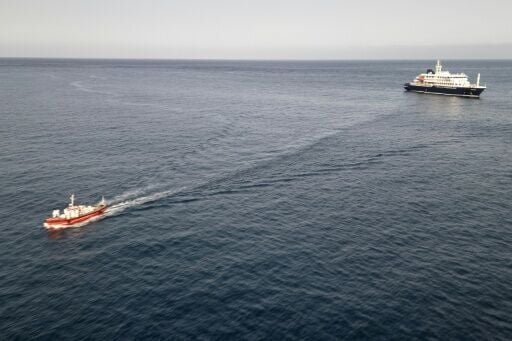 Two crew members and one other person thought to be infected were taken off the ship