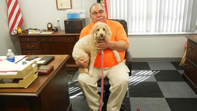 Festus Mayor Mike Cage with his dog, Maggie.