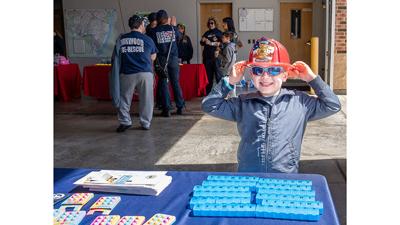 Colton Cherry, then 5, of Arnold received a Junior Fire fighter helmet at the Rock Community Fire Protection District open house last year.