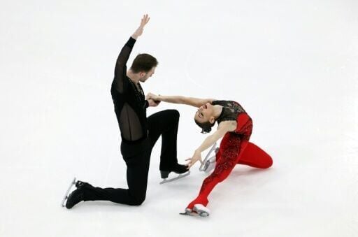 Anastasiia Metelkina and Luka Berulava of Georgia lead after the pairs short program at the Skate America figure skating grand prix in Lake Placid, New York