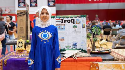 Ayana Alwaid, 10, of Arnold displays elements of her family’s heritage from Iraq on April 22 at Fox C-6 School District’s Festival of Nations event in Fox High School’s gym.