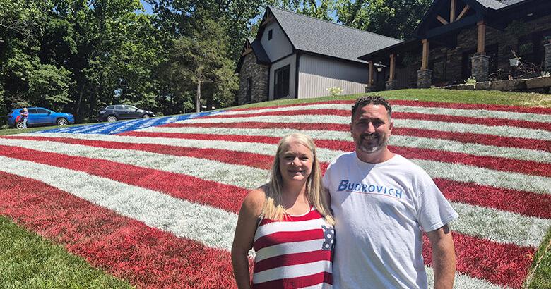 Imperial family paints large flag on their front yard