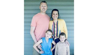 Annie Hammond, 38, poses with her husband, Zeb, and two children, Lo, left, and Mac.