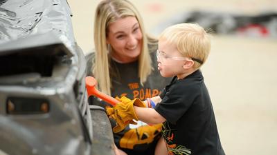 Kimberly Wood and her son, Jameson, 2, visit the Eureka Fire Protection District’s “smash car” activity during Eureka Days.