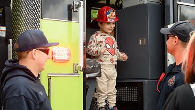 Scyros Degonia, 2, is all smiles while on Rock Fire Protection District’s firetruck during its recent open house.