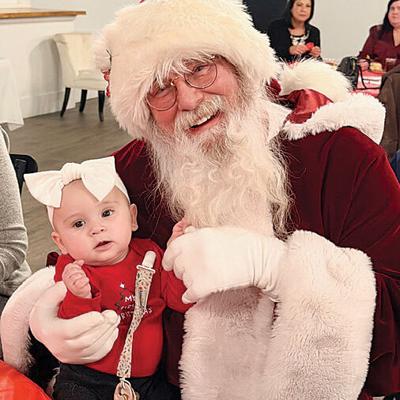 About 90 people  attended the Northwest Jefferson County Chamber of Commerce Toy Drive celebration which included a visit by Santa Claus.