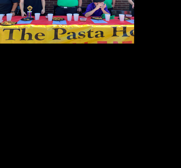 Don Jeffries of Hillsboro with his first-place trophy after eating 27 toasted ravioli five minutes.png