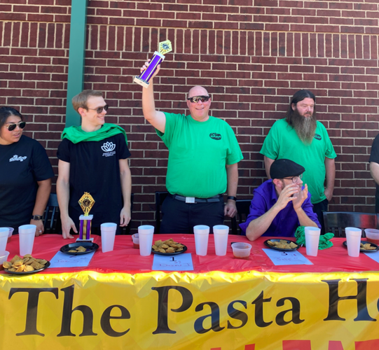 Don Jeffries of Hillsboro with his first-place trophy after eating 27 toasted ravioli five minutes.png