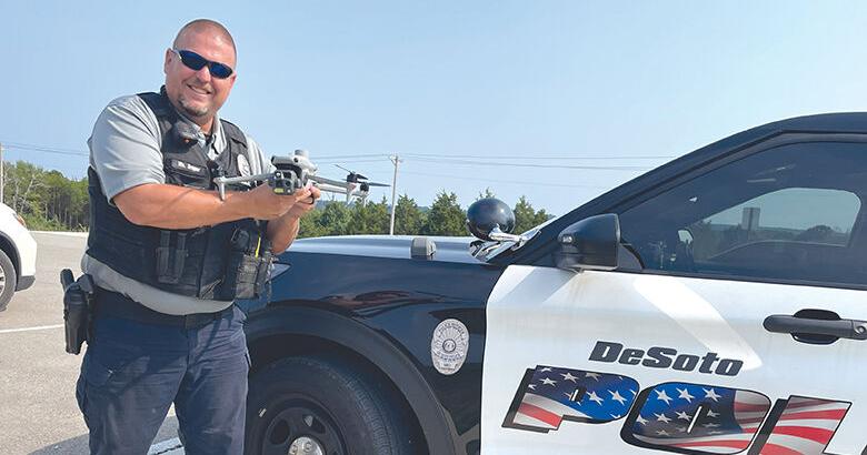 Patrolman Rick Draper holds the De Soto Police Department’s new drone.