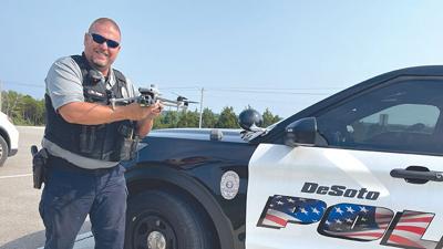 Patrolman Rick Draper holds the De Soto Police Department’s new drone.