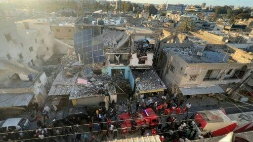 Rescuers attend site of Israeli strike on Palestinian camp in southern Lebanon