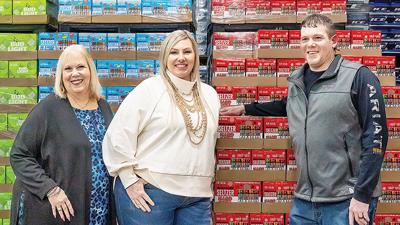 H.W. Herrell Distributing Co. president Carol Herrell-Schanz with her children, Tabitha Brauch and Nolan Schanz, who also work for company.