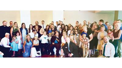 Elenora Biermann surrounded by numerous members of her family.
