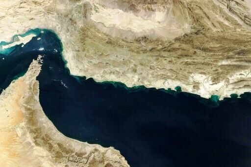 This handout natural-colour image acquired with MODIS on NASA’s Terra satellite taken on February 5, 2025 shows the Strait of Hormuz (L)