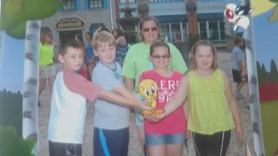 Abby, far right, with her friends and family at Six Flags, about 2010.