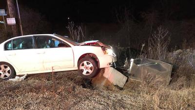 rock fire - car hits traffic lights