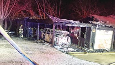 A fire at a home on Williams Creek Road in High Ridge destroyed a carport, garage, shed and pickups.
