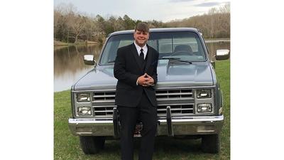 Tina Welch of Dittmer won first place last year with this picture of Austin Welch in front of the 1984 Chevrolet that his parents gifted him for graduating high school.