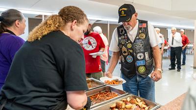 Veterans are treated to lunch at the American Legion Post 253 after a Memorial Day Ceremony on Monday.