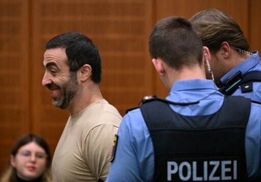 The alleged ringleader, an Armenian national partially identified as Vardges I., is led into the courtroom