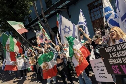 Supporters of Israel and Iranian pro-democracy activists chant slogans and hold flags in Cape Town