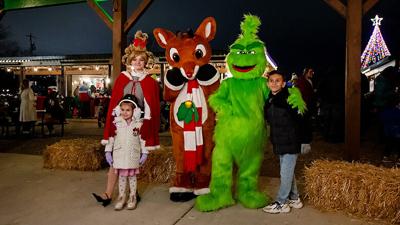 Sophia Cica, then 4, and Liam Cica, then 9, of Arnold pose with Cindy Lou Who, Rudolph and the Grinch at last year’s Christmas in the park.